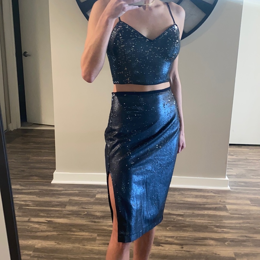 Two piece set (skirt and top). Blue and silver double sided sequence.